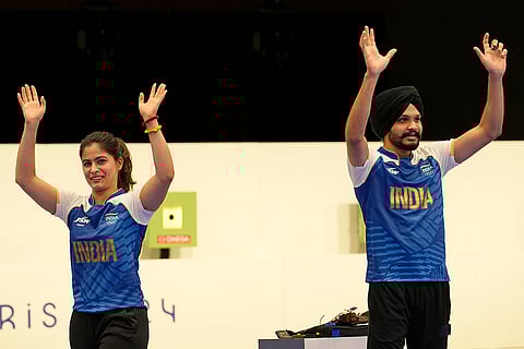Manu Bhaker and Sarabjot Singh celebrate after winning bronze in 10m air pistol mixed team event